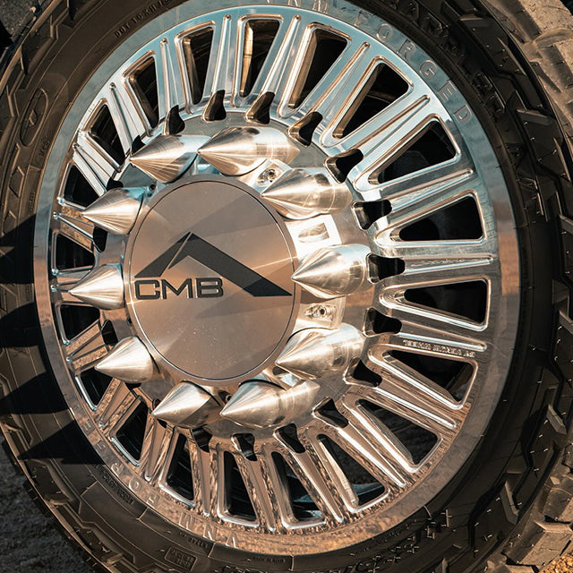 vnm forged wheel with floating center caps, wheel center caps, custom engraved wheel caps, spinning with billet spikes